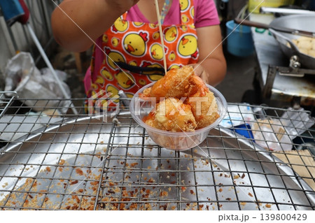 Street Vendor Serving Fried Shrimp and Egg Rolls Street Vendor Serving Fried Shrimp and Egg Rolls 139800429