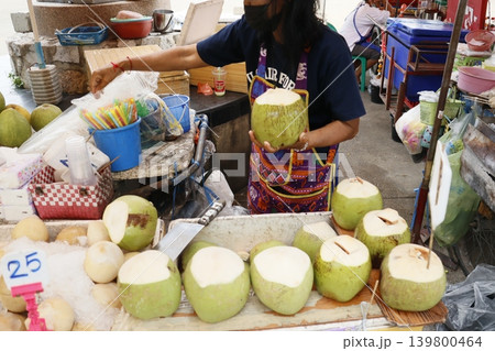 Street Vendor Selling Fresh Coconuts at Market Street Vendor Selling Fresh Coconuts at Market 139800464