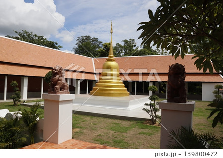 Golden Stupa in Traditional Courtyard with Stone Lions 139800472