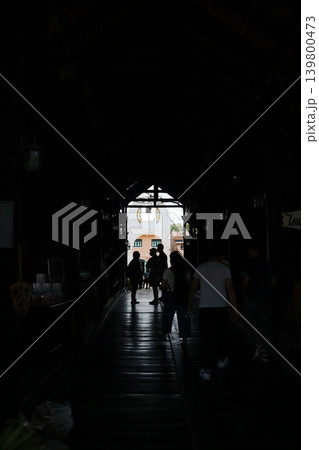 Silhouetted Figures in Dimly Lit Interior Space Silhouetted Figures in Dimly Lit Interior Space 139800473