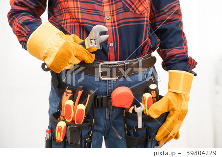 Male builder worker with tool belt pocket at waist. 139804229