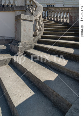 A sweeping horseshoe staircase of weathered stone ascends gracefully in front of the Queen's House. This Palladian-inspired design breaks sharply away from traditional Tudor constraints. Bright A sweeping horseshoe staircase of weathered stone ascends gracefully in front of the Queen's House. This Palladian-inspired design breaks sharply away from traditional Tudor constraints. Bright 139804731