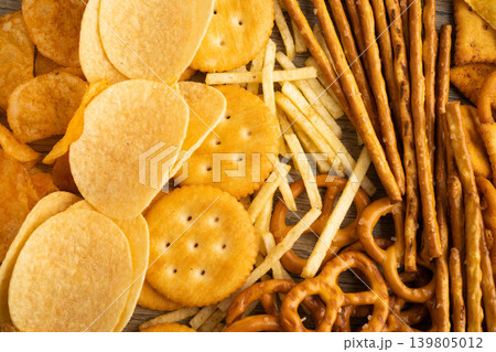 Mix of variety snack chips pretzel and cracker, junk crunchy food. Mix of variety snack chips pretzel and cracker, junk crunchy food. 139805012