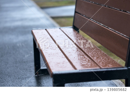Water droplets gather on wooden surface after rain in a quiet area during the day Water droplets gather on wooden surface after rain in a quiet area during the day 139805682