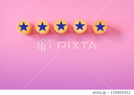 Star sign over wood cube on color background. 139805852