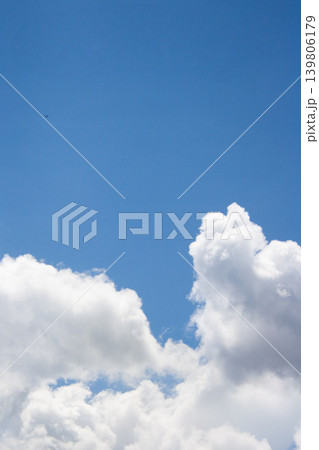 Blue sky filling frame with fluffy cumulus clouds on a bright sunlit day demonstrating clear weather and natural beauty in a serene outdoor setting Blue sky filling frame with fluffy cumulus clouds on a bright sunlit day demonstrating clear weather and natural beauty in a serene outdoor setting 139806179