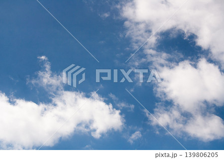 Clear blue sky with white clouds creating a beautiful natural background for copy space and environmental themes Clear blue sky with white clouds creating a beautiful natural background for copy space and environmental themes 139806205