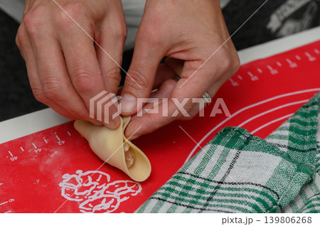 Mastering the art of dumpling making in a cozy kitchen during a culinary afternoon Mastering the art of dumpling making in a cozy kitchen during a culinary afternoon 139806268