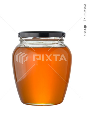 Glass jar with natural transparent golden honey isolated on white background Glass jar with natural transparent golden honey isolated on white background 139806508