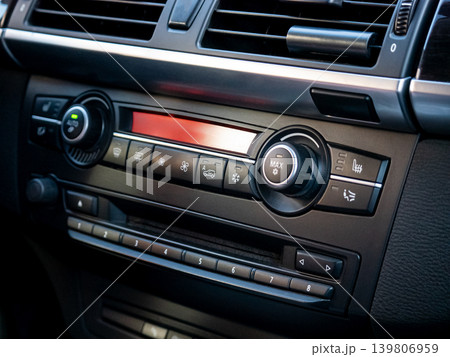Close up of an automotive dashboard showing climate control and radio navigation system in a new modern car for transportation design 139806959