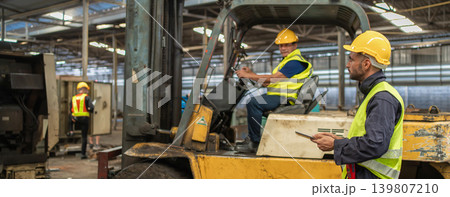 Man worker at forklift driver happy working in industry factory logistic ship. Man worker at forklift driver happy working in industry factory logistic ship. 139807210