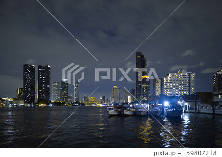Night view of Bangkok skyline with boats on the river Night view of Bangkok skyline with boats on the river 139807218