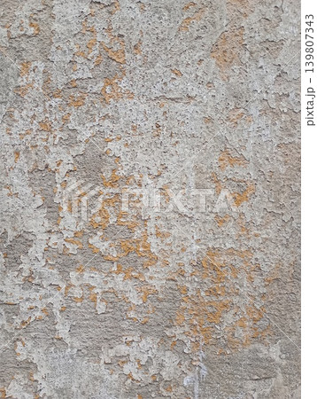 Old concrete wall, damaged, uneven structure, with remnants of yellow paint, vintage background for design Old concrete wall, damaged, uneven structure, with remnants of yellow paint, vintage background for design 139807343