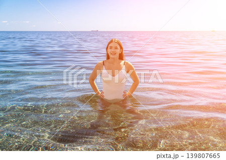 Woman swimming vacation, happy attractive girl enjoying clear water during summer holiday at the seaside. Woman swimming vacation, happy attractive girl enjoying clear water during summer holiday at the seaside. 139807665