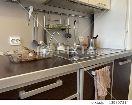 a sink in the kitchen with lamp lighting a sink in the kitchen with lamp lighting 139807814
