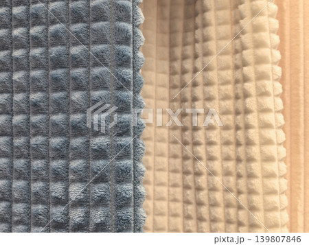 Close up of blue and cream plush waffle textured fleece blanket fabric Close up of blue and cream plush waffle textured fleece blanket fabric 139807846