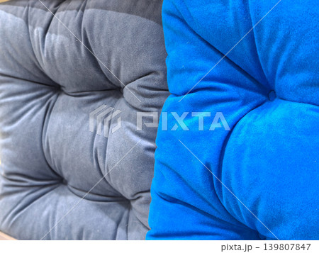 Gray and blue velvet tufted cushions close up texture background Gray and blue velvet tufted cushions close up texture background 139807847