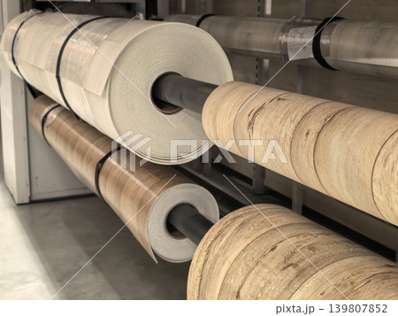 Linoleum flooring rolls stacked on shelves in hardware store warehouse Linoleum flooring rolls stacked on shelves in hardware store warehouse 139807852