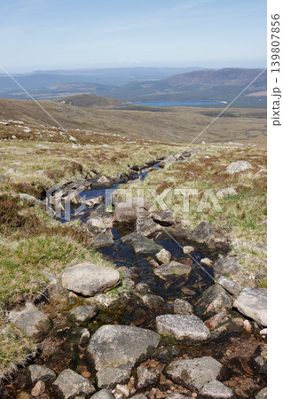 Rocky stream flowing into valley from Cairngorm mountains, Scotland Rocky stream flowing into valley from Cairngorm mountains, Scotland 139807856