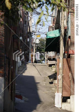 Urban Alley with Overhead Wires and Market Signs Urban Alley with Overhead Wires and Market Signs 139808061