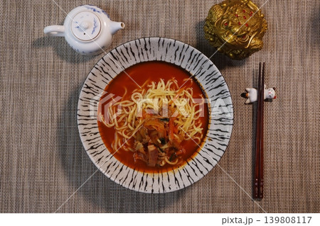 Spicy Noodle Soup with Traditional Tableware Spicy Noodle Soup with Traditional Tableware 139808117
