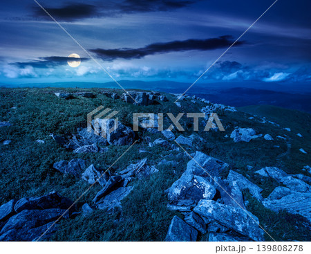 alpine grassy meadow at night. full moon over carpathian mountains landscape with huge boulders. alpine nature scenery of ukraine highlands in summer. mysterious view of remote place in mountains alpine grassy meadow at night. full moon over carpathian mountains landscape with huge boulders. alpine nature scenery of ukraine highlands in summer. mysterious view of remote place in mountains 139808278