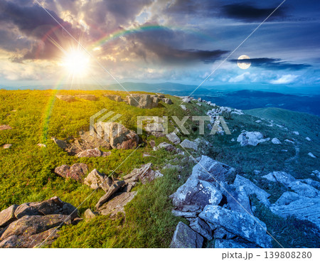 alpine grassy meadow. day meet night. sun and moon over carpathian mountains landscape with boulders. alpine nature scenery of ukraine highlands on summer solstice. view of remote place in mountains alpine grassy meadow. day meet night. sun and moon over carpathian mountains landscape with boulders. alpine nature scenery of ukraine highlands on summer solstice. view of remote place in mountains 139808280
