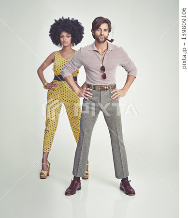 Couple, portrait and fashion in confidence with pipe for smoking, style or outfit on a gray studio background. Interracial man, woman or smoker in stylish retro and vintage pants, shirt or jumpsuit Couple, portrait and fashion in confidence with pipe for smoking, style or outfit on a gray studio background. Interracial man, woman or smoker in stylish retro and vintage pants, shirt or jumpsuit 139809106