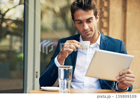 Businessman, tablet and coffee at cafe for online research or communication, internet or social media. Male person, espresso and reading at city restaurant in Italy for work trip, networking or email Businessman, tablet and coffee at cafe for online research or communication, internet or social media. Male person, espresso and reading at city restaurant in Italy for work trip, networking or email 139809109