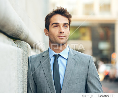 Thinking, idea and businessman in city with brainstorming, planning or memory facial expression. Remember, suit and handsome professional male accountant with confidence outdoor in urban town. Thinking, idea and businessman in city with brainstorming, planning or memory facial expression. Remember, suit and handsome professional male accountant with confidence outdoor in urban town. 139809111