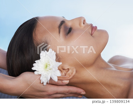 Sleeping, head massage or hands with woman or flower in spa for wellness, treatment or hospitality. Peace, relax or client with masseuse in hotel on holiday vacation for beauty therapy in a resort 139809134