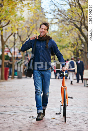 Happy man, portrait and push bicycle in city to travel on eco friendly transport outdoor, commute and trip. Cycling, person and bike in urban town, street and road for journey at sidewalk of park Happy man, portrait and push bicycle in city to travel on eco friendly transport outdoor, commute and trip. Cycling, person and bike in urban town, street and road for journey at sidewalk of park 139809216