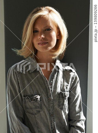 Portrait, woman and sunshine for fashion, smile and relaxation with face, glow and style. Aesthetic model, summer and hair with casual, happiness and backdrop for care and denim clothes or shirt Portrait, woman and sunshine for fashion, smile and relaxation with face, glow and style. Aesthetic model, summer and hair with casual, happiness and backdrop for care and denim clothes or shirt 139809266