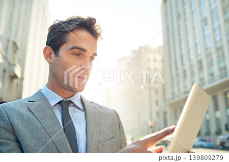 Serious, tablet and businessman in city networking on social media, mobile app or the internet. Career, research and professional male lawyer reading blog on website with digital technology in town. Serious, tablet and businessman in city networking on social media, mobile app or the internet. Career, research and professional male lawyer reading blog on website with digital technology in town. 139809279