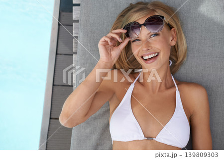 Portrait, swimming pool and woman with smile, sunglasses and vacation with happiness and relaxing on weekend break. Face, person or girl with eyewear or water with summer or holiday with getaway trip Portrait, swimming pool and woman with smile, sunglasses and vacation with happiness and relaxing on weekend break. Face, person or girl with eyewear or water with summer or holiday with getaway trip 139809303