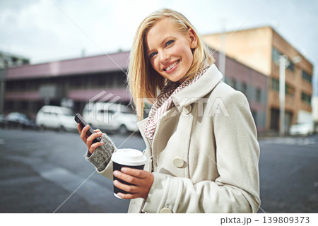 Happy, phone and portrait of woman with coffee in city for commute, walking and journey in street. Travel, fashion and face of person with drink on cellphone for contact, connection and social media Happy, phone and portrait of woman with coffee in city for commute, walking and journey in street. Travel, fashion and face of person with drink on cellphone for contact, connection and social media 139809373