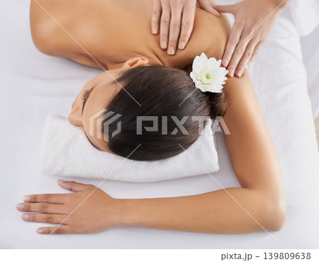 Woman, back massage and spa treatment for relaxing, wellness and physical therapy for body care. Top view, hands and nudity of female person on bed, beauty and resting for skincare and peace or zen Woman, back massage and spa treatment for relaxing, wellness and physical therapy for body care. Top view, hands and nudity of female person on bed, beauty and resting for skincare and peace or zen 139809638