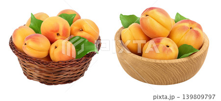 apricot fruit in a wicker basket and wooden bowl isolated on white background. Clipping path and full depth of field 139809797