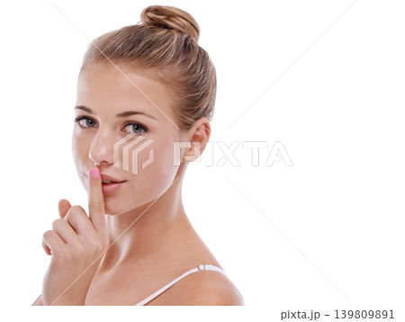 Woman, portrait and finger for privacy in studio, quiet and confidential information or news. Female person, shush and silent emoji for gossip or drama, secret and whisper icon on white background 139809891