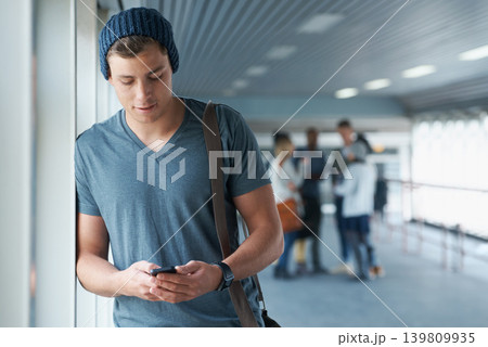 Phone, student or man on social media in college with online research for entertainment on blog website. University, communication or reading article on mobile app for news post on internet to relax 139809935