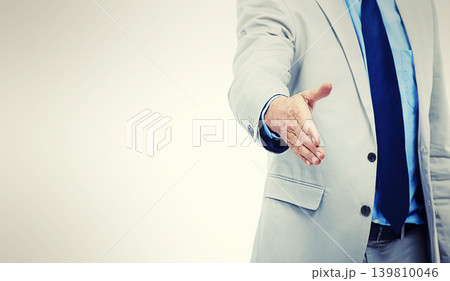 Businessperson, handshake and gesture for agreement or deal for hiring or partnership, welcome or onboarding. Person, fingers and mockup space or white background for greeting, studio or professional Businessperson, handshake and gesture for agreement or deal for hiring or partnership, welcome or onboarding. Person, fingers and mockup space or white background for greeting, studio or professional 139810046