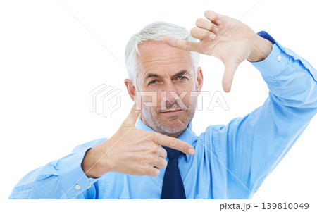 Finger frame, portrait and businessman in studio for posing with picture capture expression. Serious, photography and senior professional male person with border hand gesture by white background. 139810049