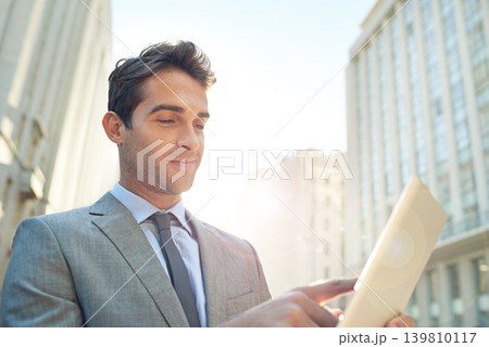 Happy, tablet and businessman in city networking on social media, app or the internet. Smile, research and professional male lawyer reading blog on website with digital technology in urban town. Happy, tablet and businessman in city networking on social media, app or the internet. Smile, research and professional male lawyer reading blog on website with digital technology in urban town. 139810117