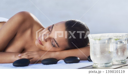Sleeping, hot stone or woman in spa with beauty or flower for wellness, treatment or hospitality. Relax, resort or healing therapy for happy person, client or masseuse in hotel on holiday vacation Sleeping, hot stone or woman in spa with beauty or flower for wellness, treatment or hospitality. Relax, resort or healing therapy for happy person, client or masseuse in hotel on holiday vacation 139810119