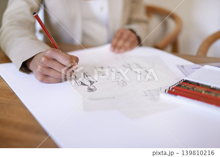 Tailor, hands or drawing on paper with pencil in startup office of small business. Creative, closeup or fashion designer sketch at desk for project illustration, planning or writing draft for clothes 139810216