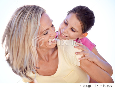 Mother, daughter and happy with piggyback in studio for bonding, support and hug on holiday with relax. Family, woman and girl child with fun, smile and embrace with love or care on white background 139810305