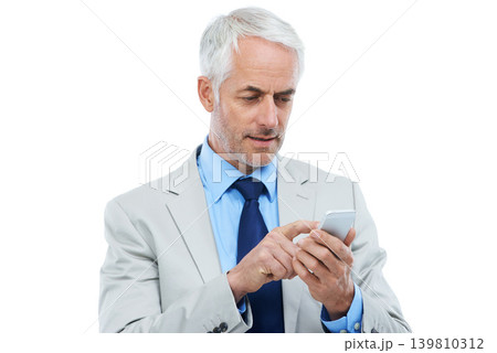 Phone, networking and senior businessman in studio reading corporate blog on the internet. Technology, manager and professional mature ceo scroll on mobile app with cellphone by white background. 139810312