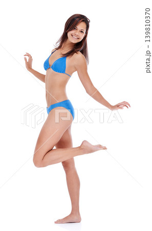 Woman, bikini and happy for studio portrait with pride, confidence or smile by white background. Girl, person and fashion model with blue clothes in summer with swimsuit on holiday for style in Italy Woman, bikini and happy for studio portrait with pride, confidence or smile by white background. Girl, person and fashion model with blue clothes in summer with swimsuit on holiday for style in Italy 139810370