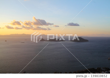 Seaside town of Turgutreis and spectacular sunsets. aerial view of islands and sea Seaside town of Turgutreis and spectacular sunsets. aerial view of islands and sea 139810652
