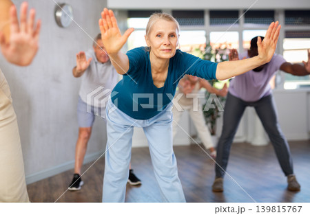 Senior woman dances learn to move energetically to beat of music Senior woman dances learn to move energetically to beat of music 139815767